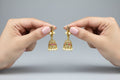 Gold-Plated Pearl Jhumka Earrings with Multicolor Stone Detailing